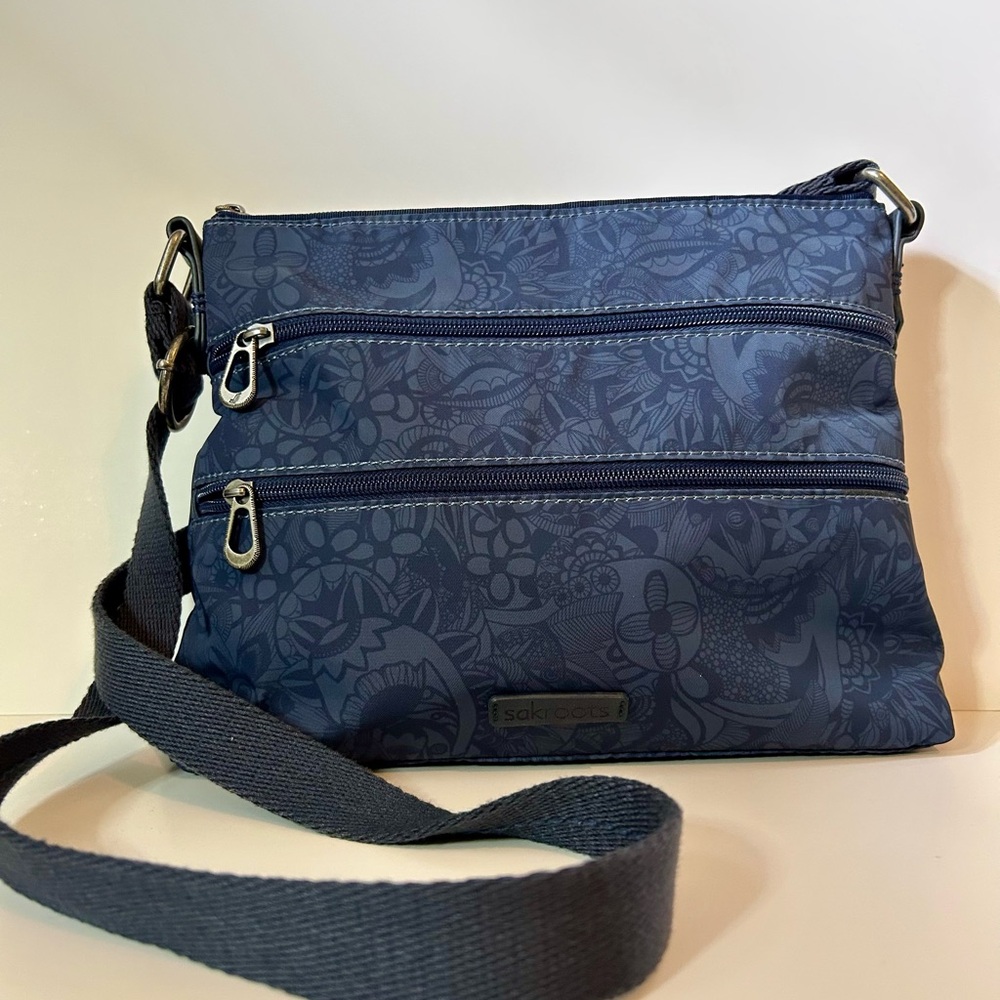 SAKROOTS Multi-Pocket Crossbody Bag